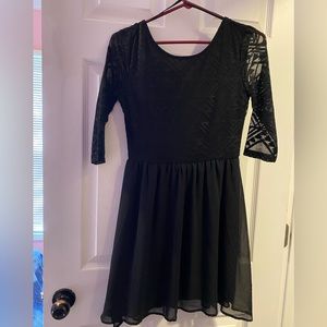 Black dress with 3 quarter length sleeves & Aztec designs